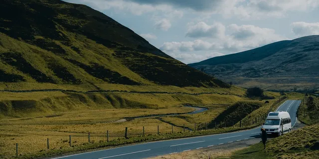 A camper goes along a Scottish road.