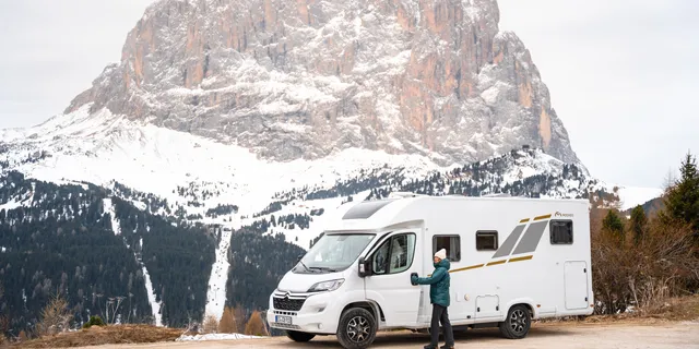 A Mooveo Off RV stands in front of the Dolomites