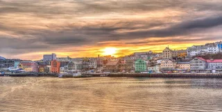 City on the coast of Norway at sunset
