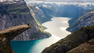 Person sitting at the front of the Trolltunga Norway