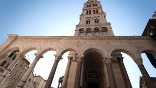 Diocletian Palace in Split on Croatia from bright stone in front of blue sky
