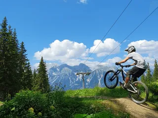 Mountain biker makes Stunt in a bike park