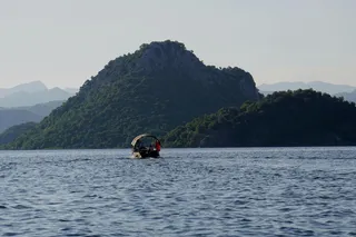 A boat rides over the Skadar lake in Montenegro.