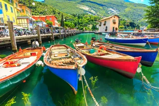 Many small colorful boats on Lake Garda
