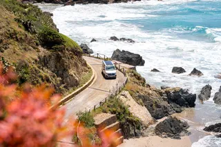 VW California on coast road