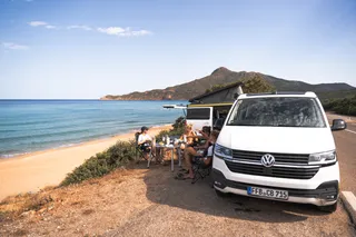 VW California Ocean camping on the beach in Greece