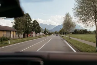 View from the camper window on road and mountains