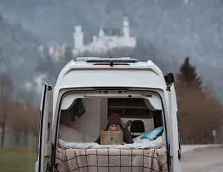 VW Grand California 600 from the back with girl inside