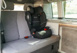 Camping seat for young children on the back bank of VW California