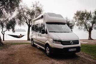 VW Grand California at a lake