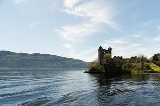 The hole Ness with the ruin of Urquhart Castle on its shores.