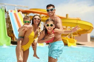 Happy family in the water park