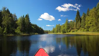 With canoe on a lake in Sweden