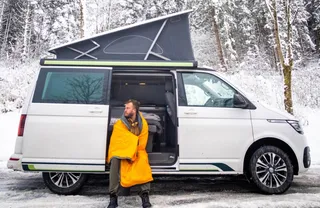 VW T6.1 California Beach Ocean is on snowy road